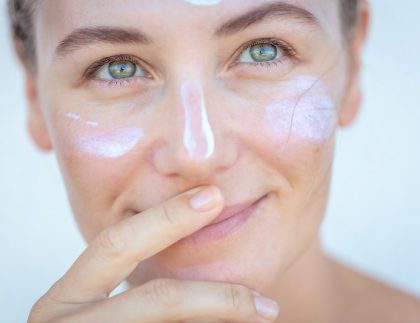 woman with sunscreen on her face